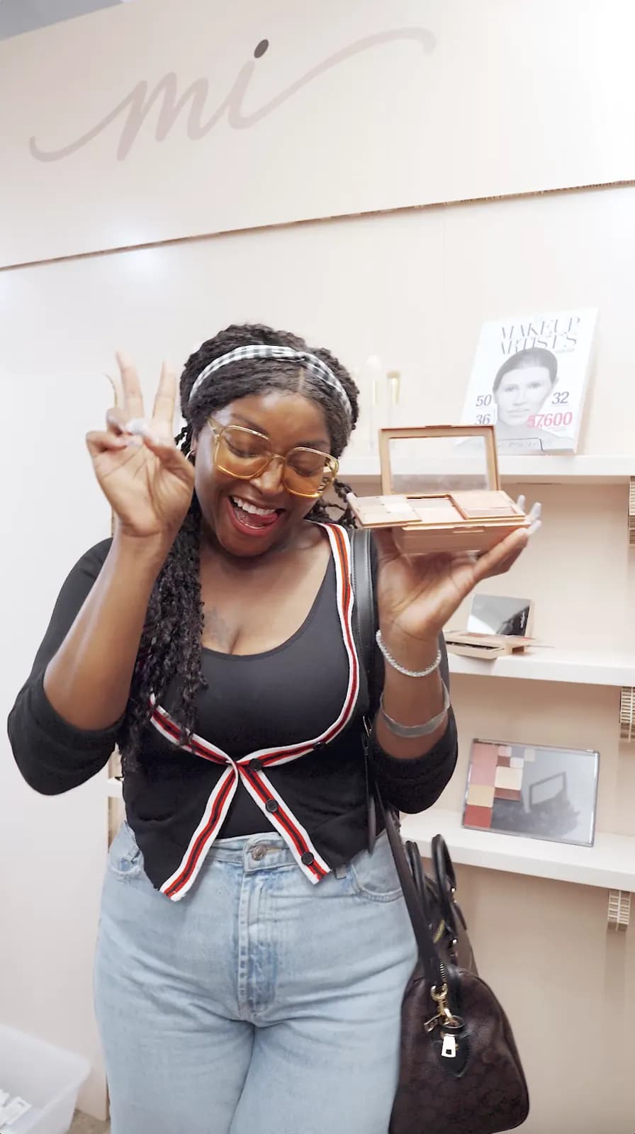 A guest holds a custom MiPalette palette.