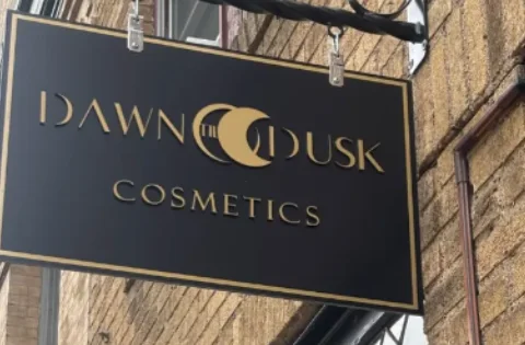 Dawn Til Dusk Cosmetics storefront sign